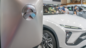 Chinese new energy car brand NIO displayed in China auto expo during covid19 pandemic. selective focus on logo.