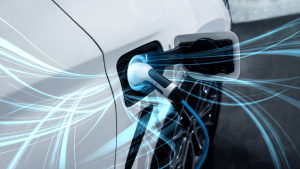 An image of an EV plugged in and charging, with blue light wisps flowing outward from the plug