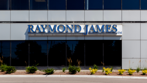 The logo for Raymond James (RJF) is seen on the side of a building.