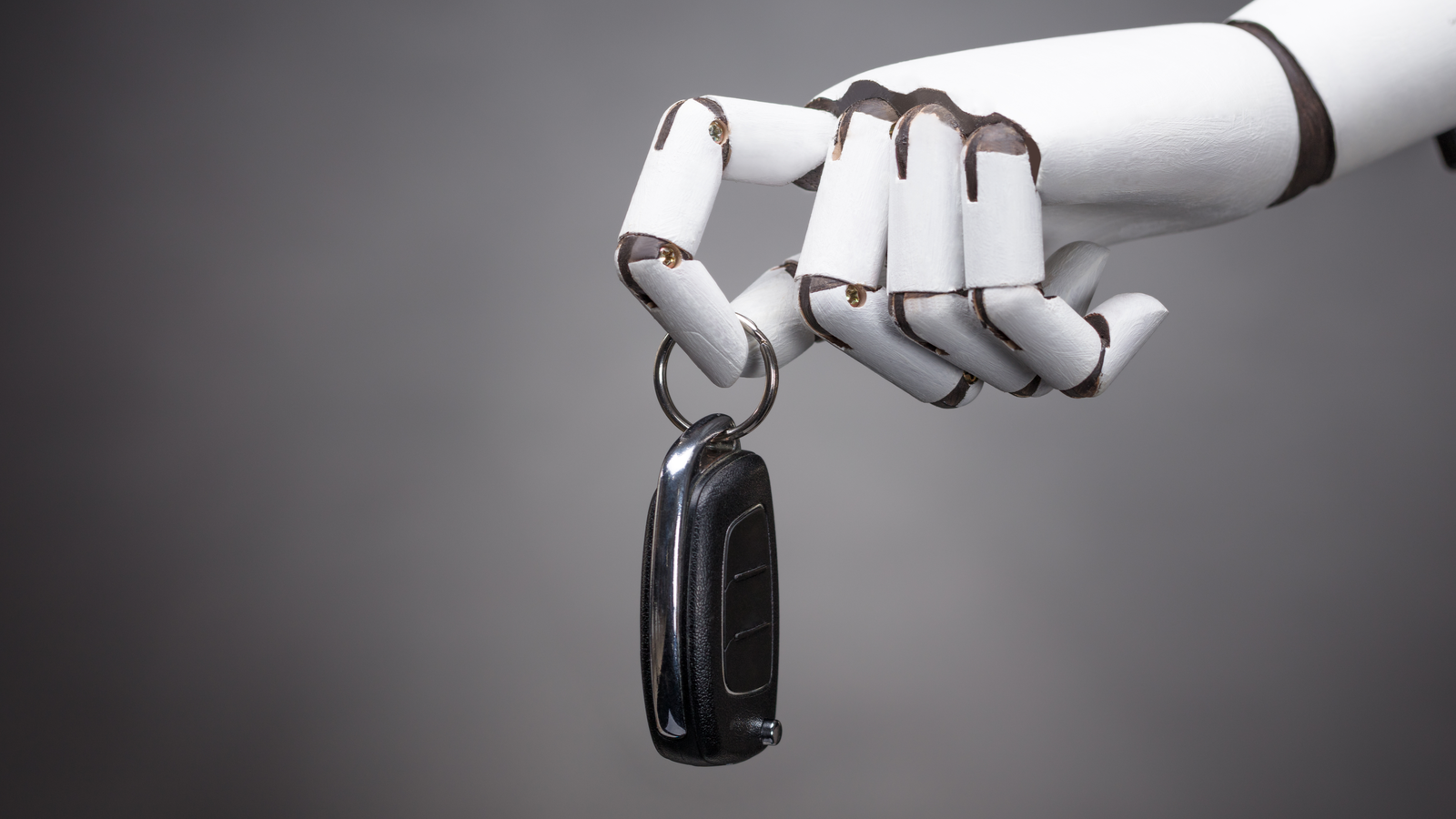 ARBE Stock. An image of a robotic hand holding a car key, autonomous driving