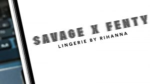 The logo for Savage X Fenty displayed on a tablet screen.