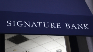 The Signature Bank logo is displayed above the entrance to a building.