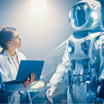 An image of a scientist holding a laptop, looking toward a high-tech spacesuit to the right