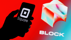 Square, Inc. changes its name to Block (SQ). Smartphone with Square logo on screen in hand against Block logo background.