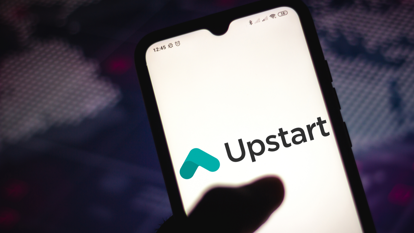 In this photo illustration the Upstart (UPST) logo seen displayed on a smartphone screen