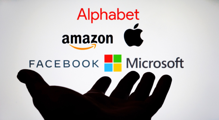 An image of the Big Tech logos above the shadow of a hand; Alphabet, Amazon, Apple, Facebook, Microsoft