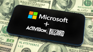 Microsoft and Activision Blizzard logo on smartphone screen close-up. tech stocks