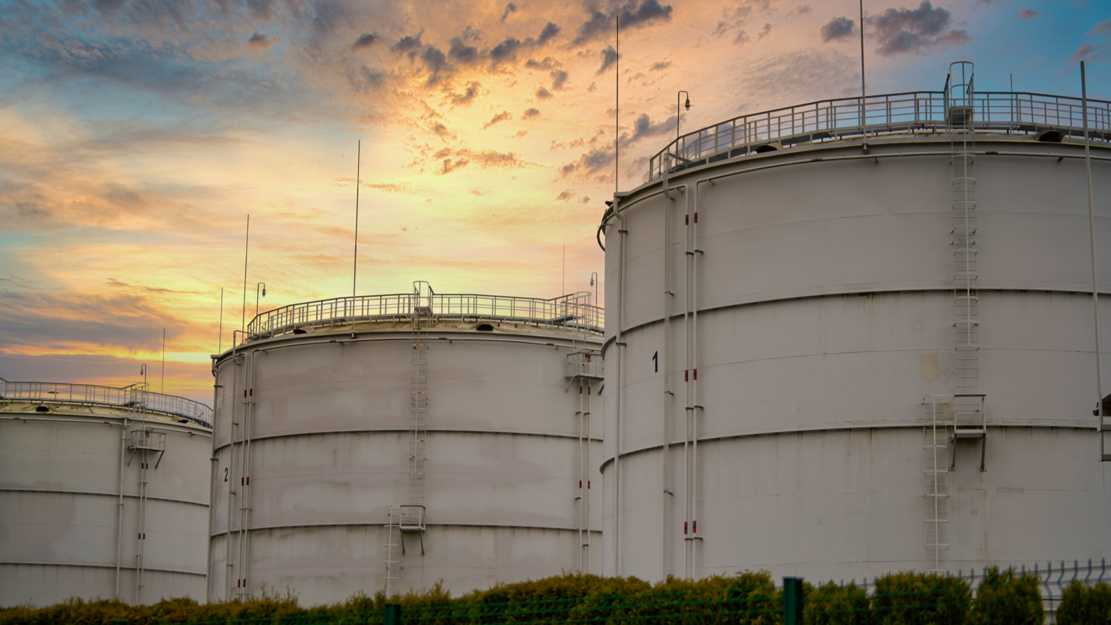 Big industrial oil tanks in a refinery base. Oil stocks., CEI stock