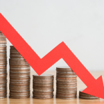 Item ID: 2127109961 Stack of coins bar chart and red graph trending downwards with white wall background on wooden table copy space. Economy recession crisis, inflation, stagflation, business and financial loss concept., penny stocks, sell. Stocks to avoid