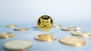 Shiba Inu (SHIB-USD) or Shib coin standing centrally placed among bunch of crypto coins on blue background. Close-up, soft focus. Banner with golden Shiba token.