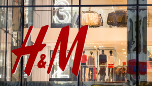 HNNMY stock: an H&M storefront featuring its logo on a window