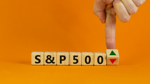 S&P 500 on wooden blocks as someone turns an arrow pointing either up or down. SPY stock. Top S&P 500 Stocks to Buy