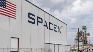 A building with the SpaceX name on the side representing MNTS stock news today.