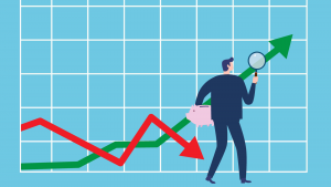 An image of a businessman holding a magnifying glass, looking at a green arrow rising on a chart.