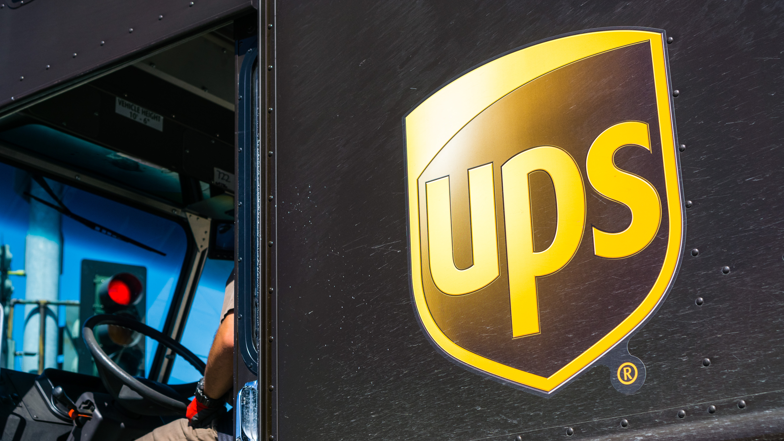 Close up of UPS logo printed on a delivery truck. UPS stock.