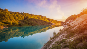 Flooded quarry for limestone mining. Turquoise water. White beaches.