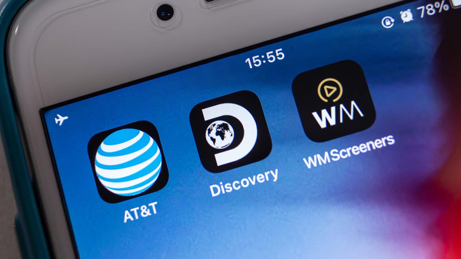 The apps for AT&T (T Stock), Discovery and WarnerMedia displayed on a smartphone screen.