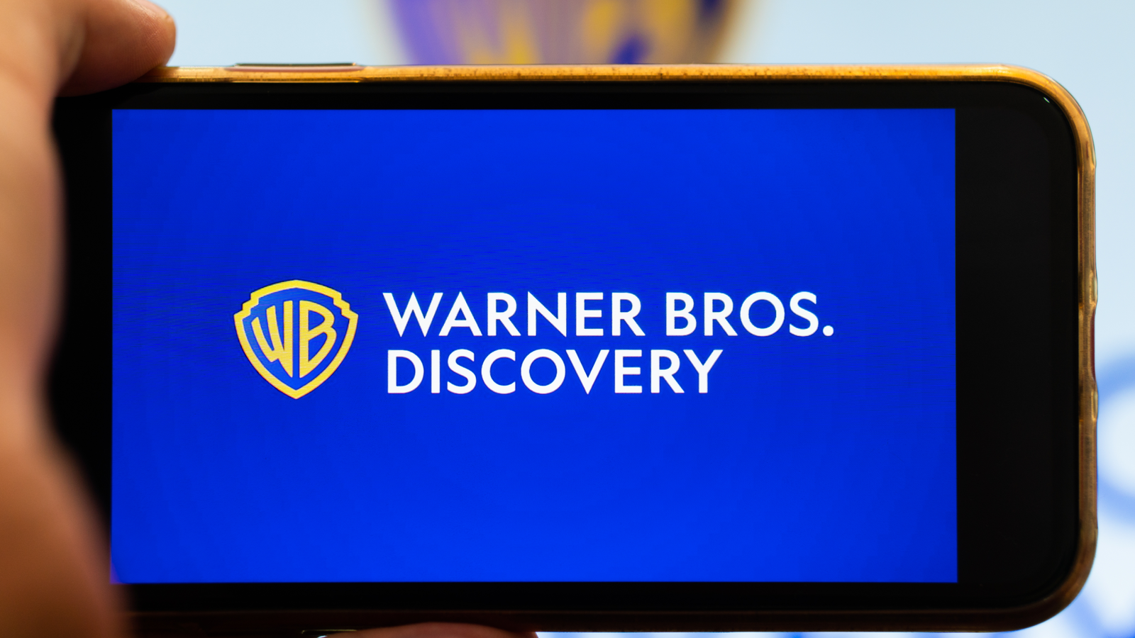 The logo of the new Warner Bros Discovery company on smartphone screen.