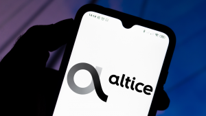  In this photo illustration the Altice USA (ATUS) logo seen displayed on a smartphone