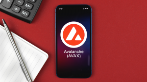 Avalanche AVAX symbol. Trade with cryptocurrency, digital and virtual money, banking with mobile phone concept. AVAX-USD