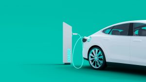 White electric car connected to power station charger on green background 3D Rendering. Electric vehicles, EVs, EV stocks.