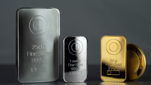 Gold and silver bars against a gray background.
