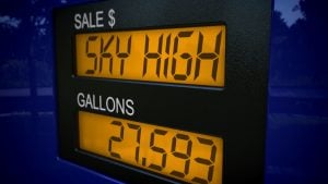 A fuel pump showing "sky high" gas prices.