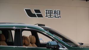 Li Auto (Li Xiang) brand logo and electric car in the store.  A Chinese electric vehicle (EV) company.