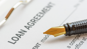 Image of a loan contract with a pen.