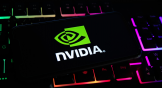 Closeup of mobile phone screen with logo lettering of nvidia corporation on computer keyboard. NVDA stock. Nvidia stock