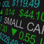 Small cap displayed on a Wall Street ticker board. Small cap stocks. Small-cap stocks.