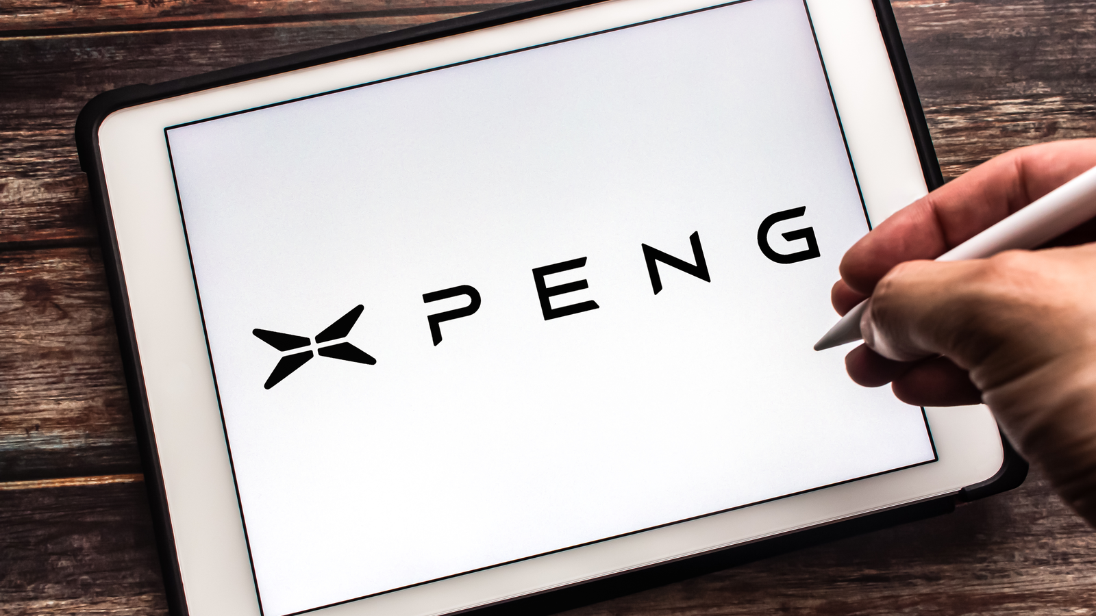 The Logo of Chinese electric vehicle manufacturer Xpeng (Guangzhou Xiaopeng Motors, also known as XMotors.ai) on tablet. XPEV Stock