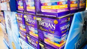 A view of several cases of Trojan condom variety packs on display at a local big box grocery store.