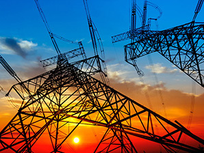 electricity pylons and lines at dusk