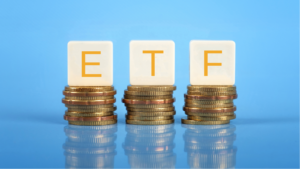 Tiles that say ETF on stacks of coins on blue background