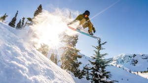 A vacationer does a ski jump in Whistler Blackcomb, a resort owned by Vail Resorts. MTN stock.