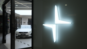 Big Polestar logo with electric car in store.  Polestar (PSNY) is a Swedish car brand owned by Volvo Cars and Geely