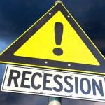 Warning sign with the word recession