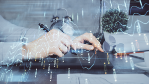 top Tech stocks to watch : Double exposure of man's hands holding and using a phone and financial graph drawing. tech stocks