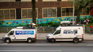 Spectrum News NY1 and WPIX news vans parked in the Chelsea neighborhood of New York. News broadcasting. SSP stock.
