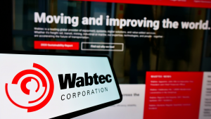 Westinghouse Air Brake Technologies Corporation (Wabtec) logo on a phone screen in front of the Wabtec website. WAB stock.