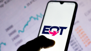 In this photo illustration the EQT Corporation logo seen displayed on a smartphone