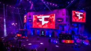 Counter Strike: Global Offensive esports event. Main stage with a big screen and team FAZE clan logo.