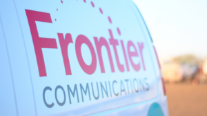 The logo for Frontier Communications (FYBR) is seen in the side of a van.
