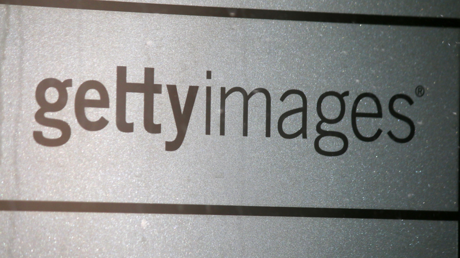 Image of Getty Image logo on gray background representing GETY Stock.