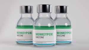Monkeypox vaccine bottled medicines standing on isolated background. Group of closed bright medical bottles with liquid for one dose to prevent a pandemic. 3D rendering. GOVX stock.