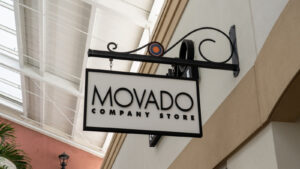 A photo of the Movado logo outside a store in a mall.