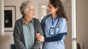 A nurse is helping a older woman. Elder care. Senior care.
