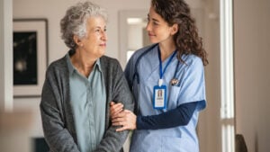 A nurse helps an elderly woman. Elderly care. Senior care.