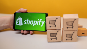 Shopify on a mobile phone display.